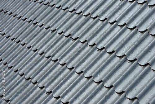 Metal roof with water drops after rain