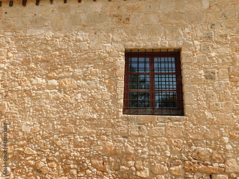 Retro photo of window with old lattice in vintage wall