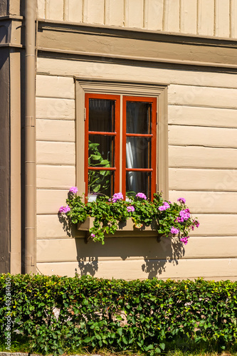 Flower box by a beautiful wooden house photo