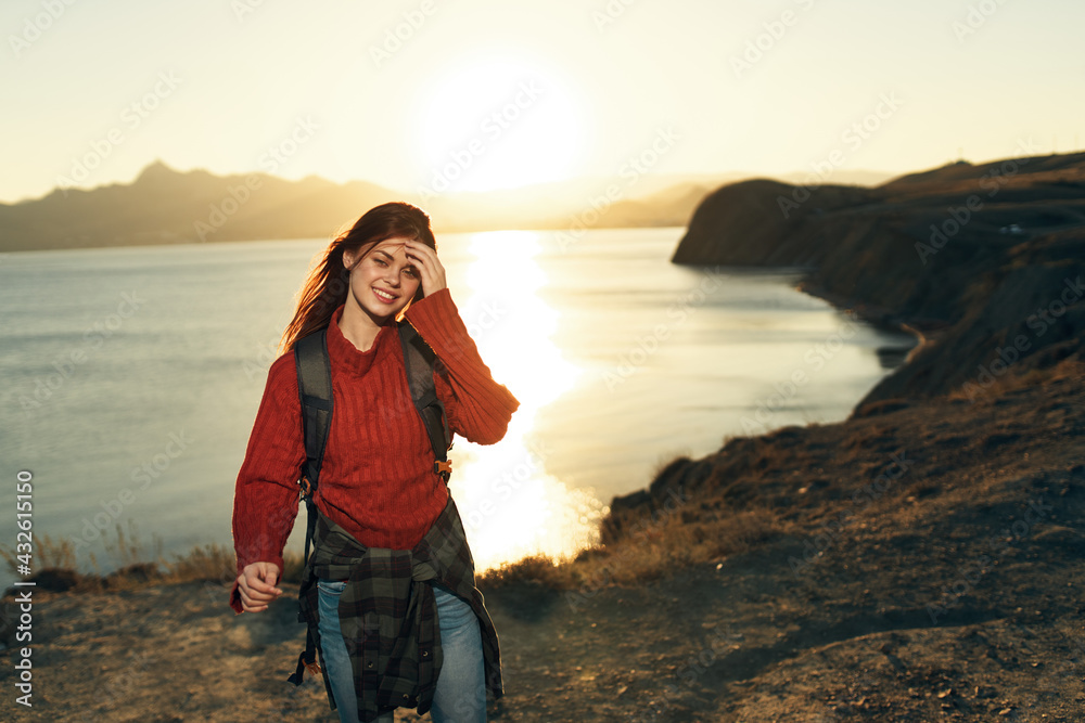 woman hiker with backpack outdoors in rocky mountains fresh air landscape woman hiker with backpack outdoors in rocky mountains fresh air landscape