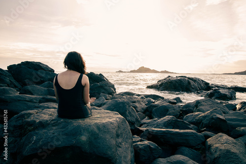 person sitting on the rocks