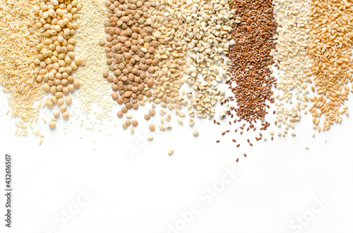 Collection of dry organic white and brown cereal and grain seeds stripe on white background, for healthy or clean food ingredient concept