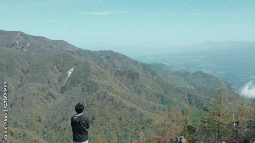 The flight above the man on a beautiful mountain The flight above the man on a beautiful mountain