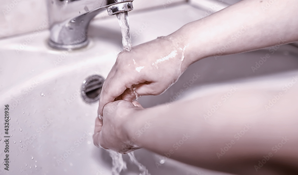 Fototapeta premium Hygiene rules. Hand washing before meals. Antibacterial treatment of hands with soap. A way to prevent virus infection. Coronavirus protection.