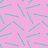 Seamless pattern with blue pencils on pink background. Art school education concept background.
