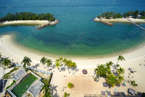 View of sentosa island beaches from Palawan beach photo