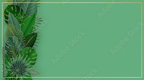 Green and gold tropical leaves on green background. 