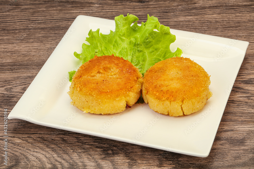 Vegan cuisine - Potato cutlet in the plate