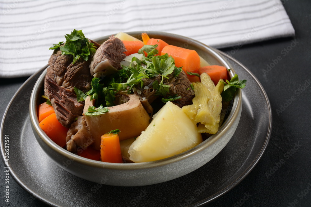Pot-au-feu, traditional french stew. Stewed beef and potatoes. In France considered a national dish. Pot-au-feu, traditional french stew. Stewed beef and potatoes. In France considered a national dish.