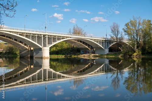 reflection of a bridge in the water 