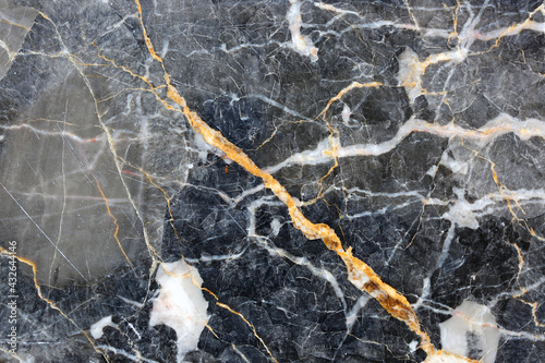 Gold and yellow patterned natural of dark gray marble (Gold Russia) texture for product design. © ImagineDesign