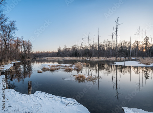 Snow and trees and rivers under the setting sun in Changbai Mountain  Jilin  China in winter 