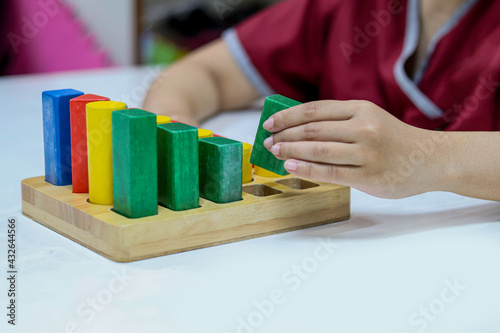 Occupational therapy: hand function training, Hand rehabilitation in stroke patient by using colorful blocks or cubes at a therapy room in the hospital.