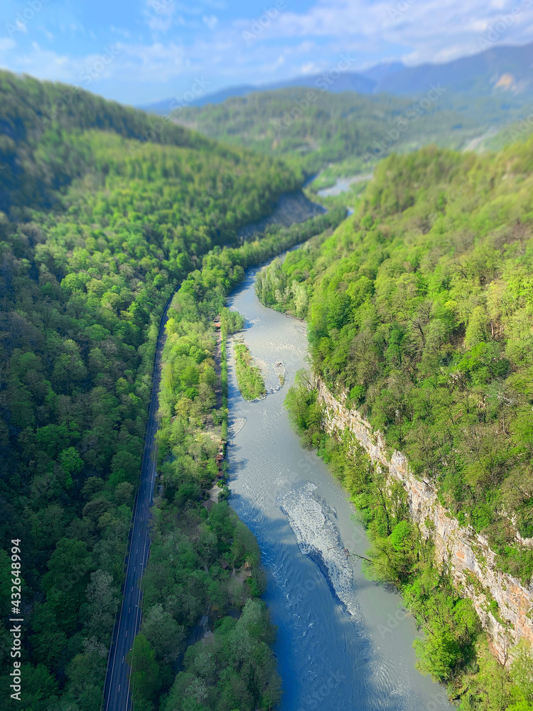 landscape of green forest, rivers, mountains, roads. Spring Sochi, Sky Park. View from above