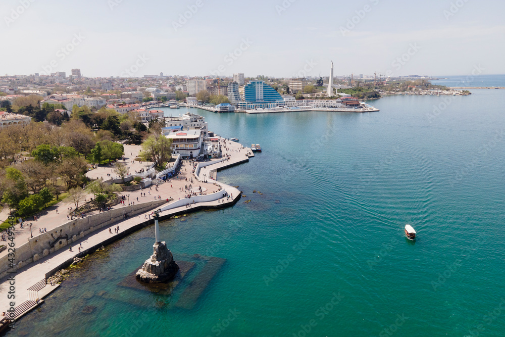 Symbol of Sevastopol, monument column with eagle dedicated to navy in sunny summer day, aerial view