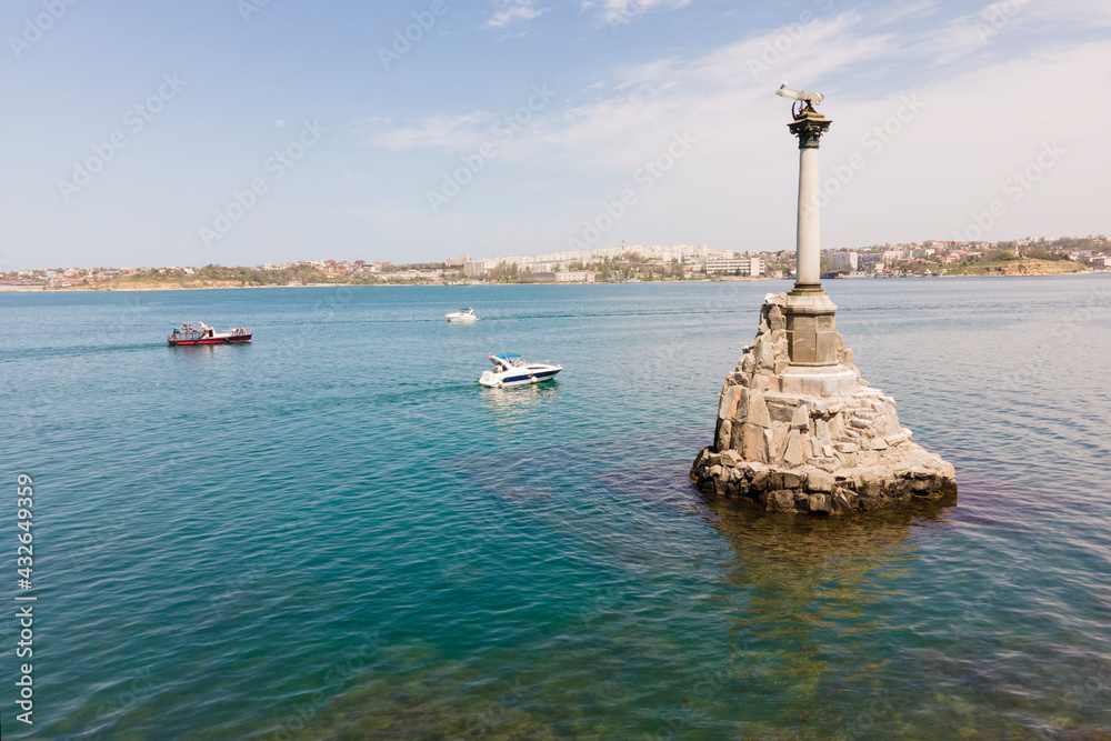 Symbol of Sevastopol, monument column with eagle dedicated to navy in sunny summer day, aerial view