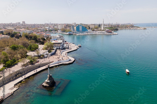 Symbol of Sevastopol, monument column with eagle dedicated to navy in sunny summer day, aerial view © Elena