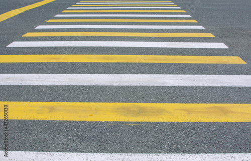 Wallpaper Mural crosswalk on the road for safety when people walking cross the street, Pedestrian crossing on a repaired asphalt road, Crosswalk on the street for safety. Torontodigital.ca