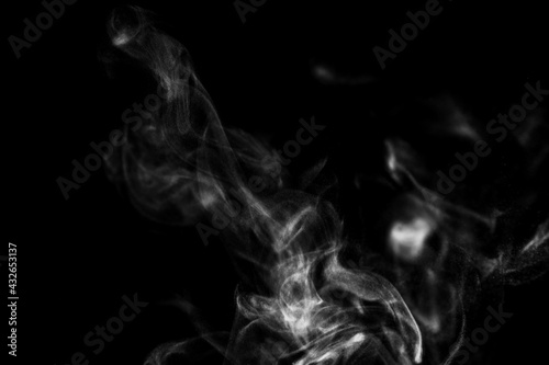 White steam smoke on solid black background with abstract blur motion wave swirl use as an overlay effect for vapor cigarette dry ice hot water and food soup