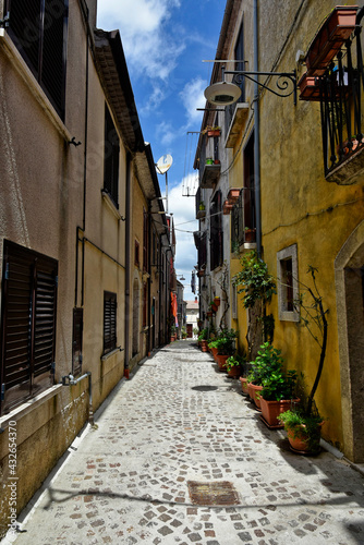 Fototapeta Naklejka Na Ścianę i Meble -  Nusco, Italy, May 8, 2021. A small street among the picturesque houses of a medieval village in the province of Avellino.