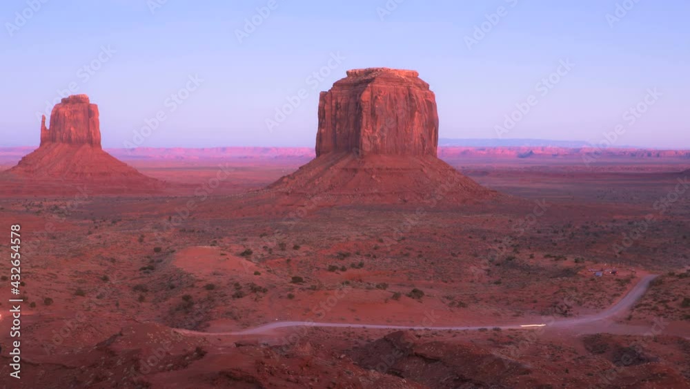 Time-lapse of an Incredible sunset at Monument Valley , a red-sand desert region on the Arizona-Utah border. Twilight video of three buttes Mitten Buttes and Merrick Butte at John Ford’s Point. Time-lapse of an Incredible sunset at Monument Valley , a red-sand desert region on the Arizona-Utah border. Twilight video of three buttes Mitten Buttes and Merrick Butte at John Ford’s Point.