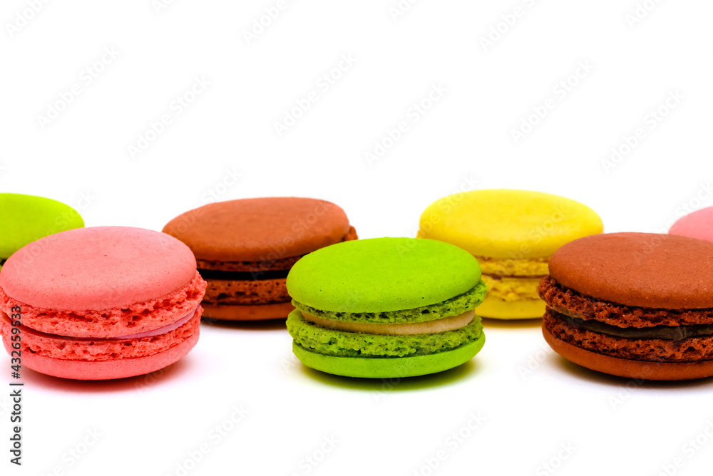 different multicolored macaron cakes on a white background different multicolored macaron cakes on a white background