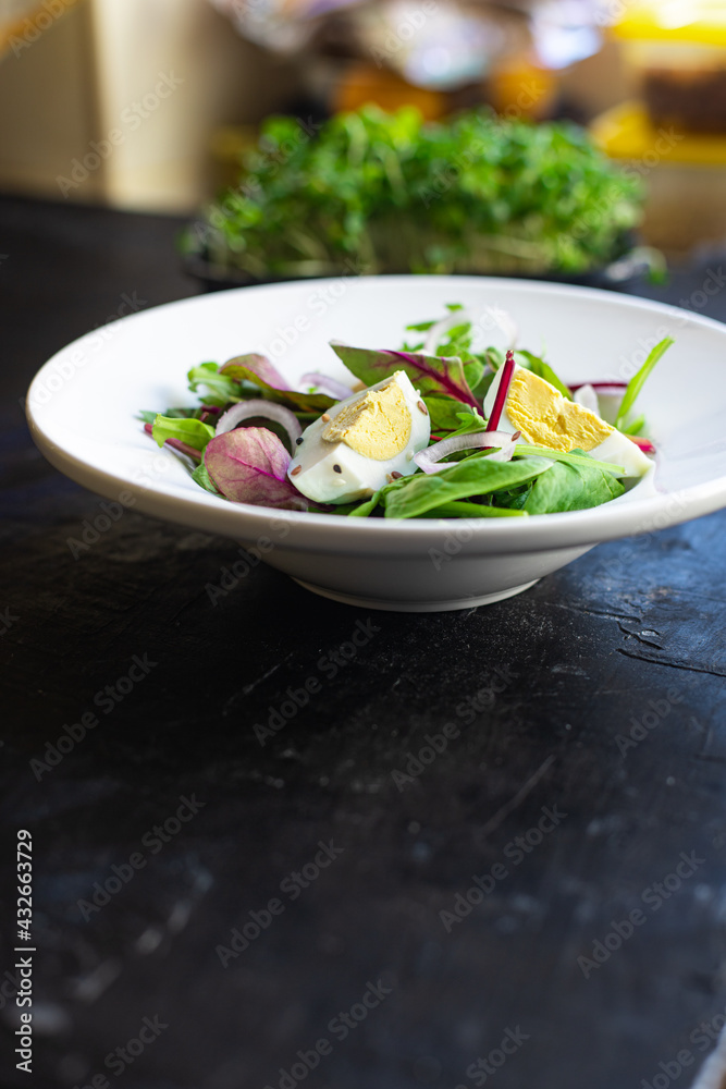 egg vegetables salad green leaves mix spinach, arugula, lettuce on the table wholesome food healthy meal snack copy space food background rustic. top view keto or paleo diet veggie or vegetarian egg vegetables salad green leaves mix spinach, arugula, lettuce on the table wholesome food healthy meal snack copy space food background rustic. top view keto or paleo diet veggie or vegetarian