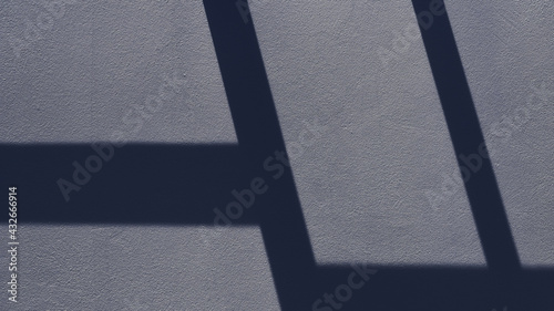 Geometric pattern on the wall formed by light and shadow