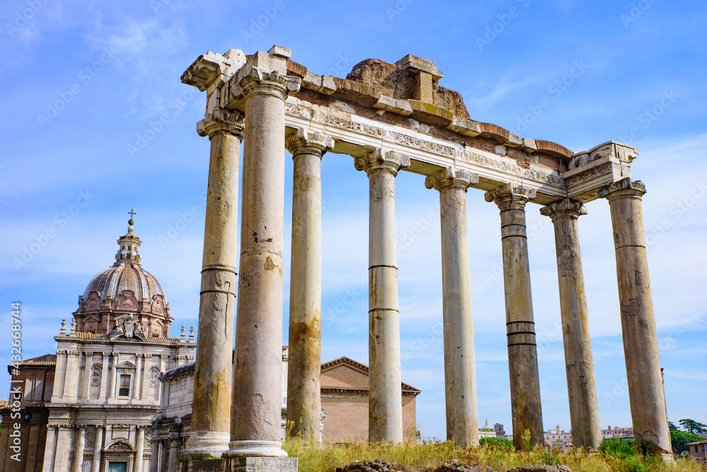 Ruins of Temple of Saturn at Roman Forum, a forum surrounded by ruins in Rome, Italy