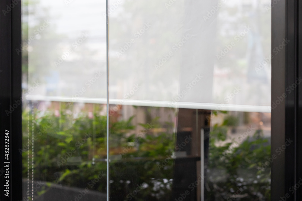 Fototapeta premium white blind curtain or blinds Roller sun protection in shop.