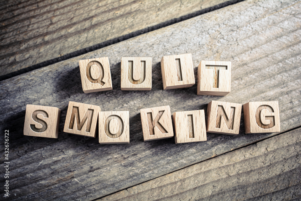 Fototapeta premium Quit Smoking Written On Wooden Blocks On A Board - Reminder Concept