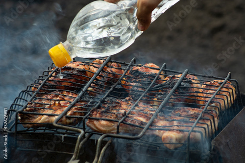 Barbecue on the grill, frying meat on the grill.