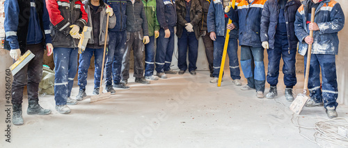 Obraz na plátně Workers and builders and foreman are as gang with dirty uniform are staying in a