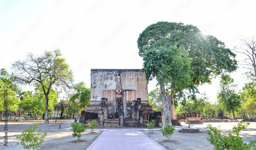 An ancient temple with a large Mara Buddha image at Wat Si Chum, known as `Phra Achana` is one of the ancient religious sites in the area of ​​Sukhothai Historical Park, Thailand.