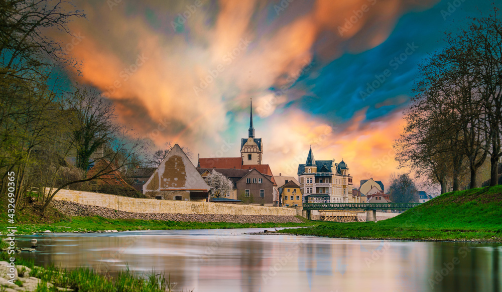 medieval castle by the river in a small European town