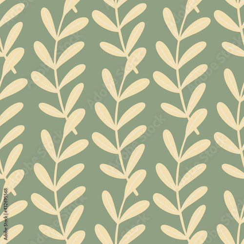 Decorative seamless pattern with light beige leaf branches ornament. Pale green background. Floral print.