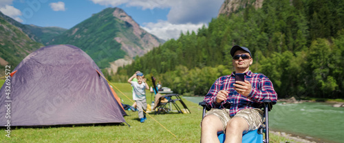 men using smart phonein the nature photo