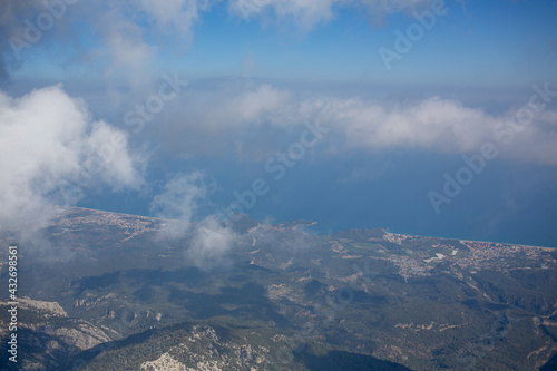 Mediterranean sea and cost view from the mountain summit through clouds