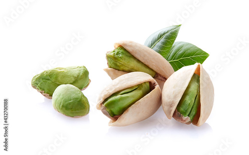 Pistachio with leaves on white background
