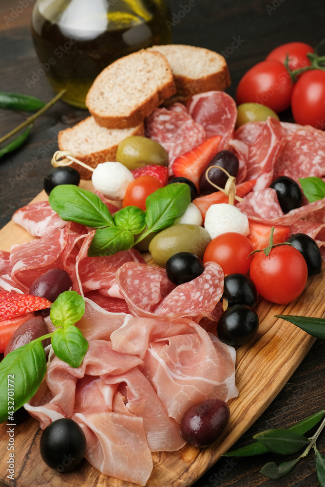 Italy food Charcuterie board salami prosciutto mozzarella olives