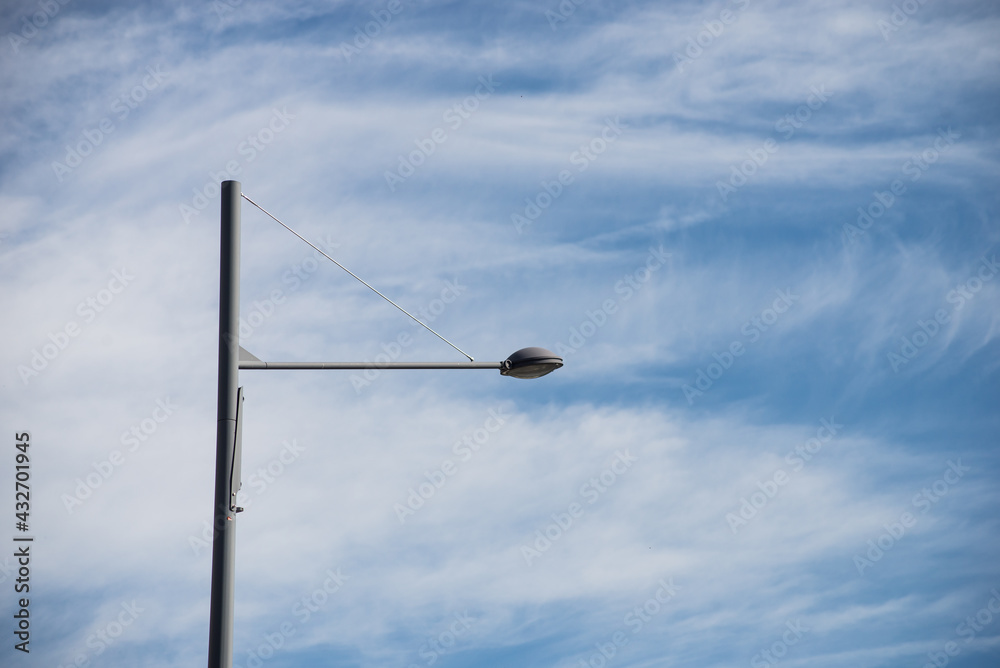 Closeup of modern street lamp on blue sky background Closeup of modern street lamp on blue sky background