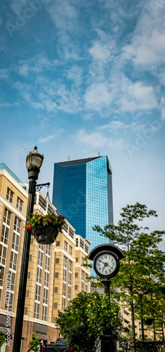 Building facades, lamp post and a clock on Main Street in downtown Lexington, Kentucky photo