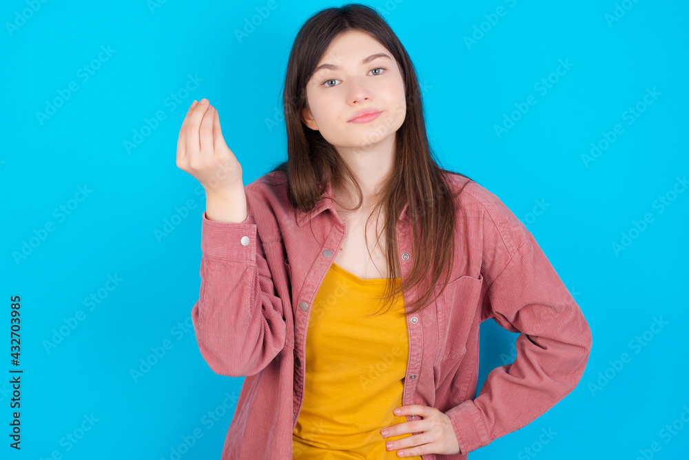 What the hell are you talking about. Shot of frustrated young beautiful Caucasian woman gesturing with raised hand doing Italian gesture, frowning, being displeased and confused with dumb question. What the hell are you talking about. Shot of frustrated young beautiful Caucasian woman gesturing with raised hand doing Italian gesture, frowning, being displeased and confused with dumb question.