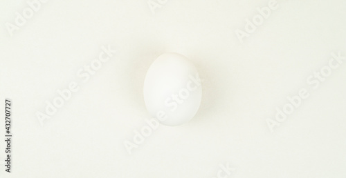 White egg on a white background  egg color minimalism
