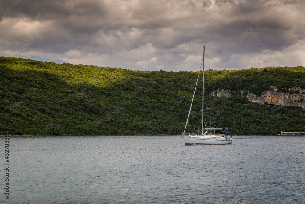 little boat sailing on a river