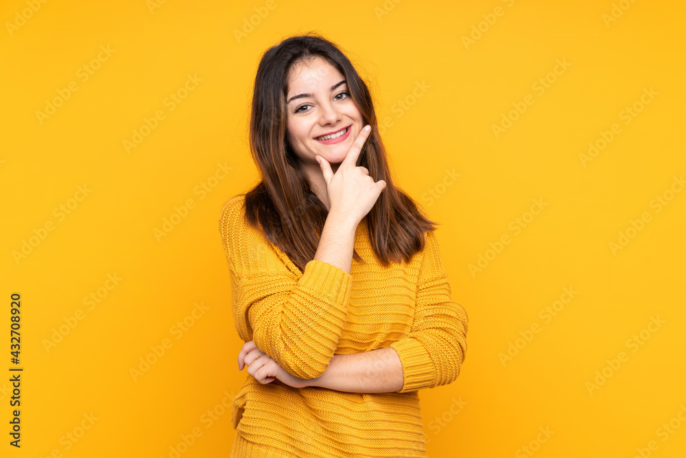 Young caucasian woman isolated on yellow background smiling Young caucasian woman isolated on yellow background smiling