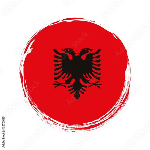 round brush painted banner with Albania flag on white background