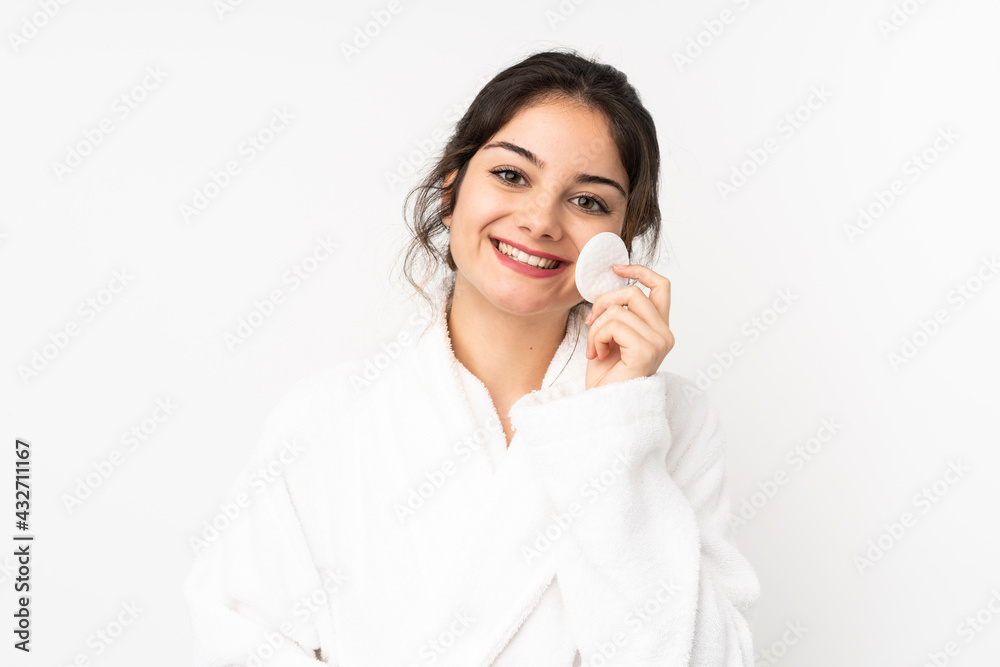 Young caucasian woman isolated on white background with cotton pad for removing makeup from her face Young caucasian woman isolated on white background with cotton pad for removing makeup from her face