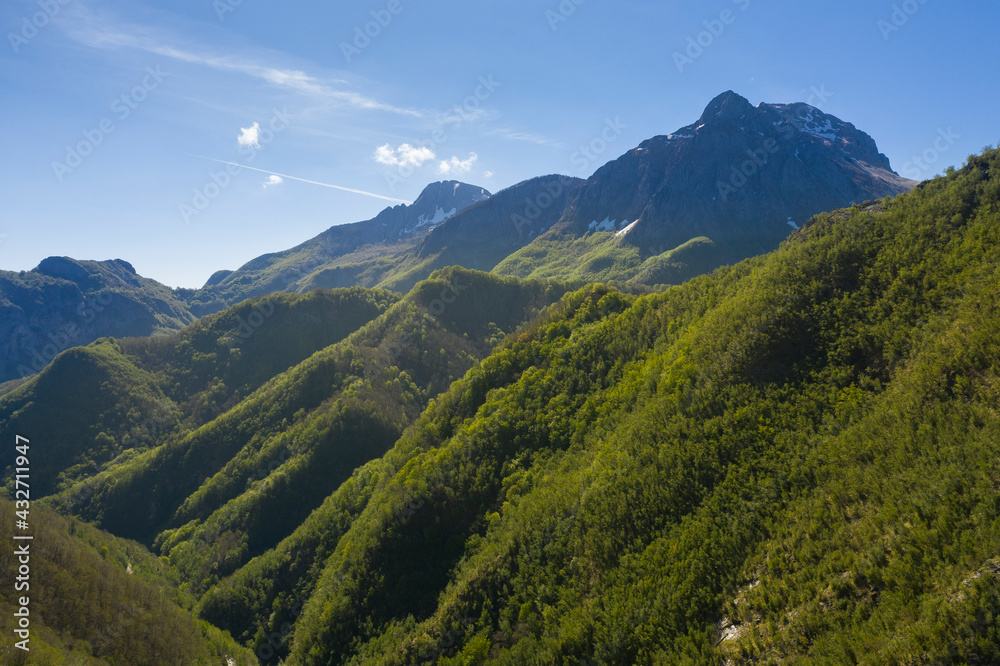 aerial view of one of the snow capped apuan alps mountains in tuscany