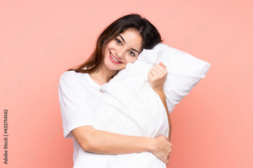 Young woman in pajamas isolated on pink background Young woman in pajamas isolated on pink background
